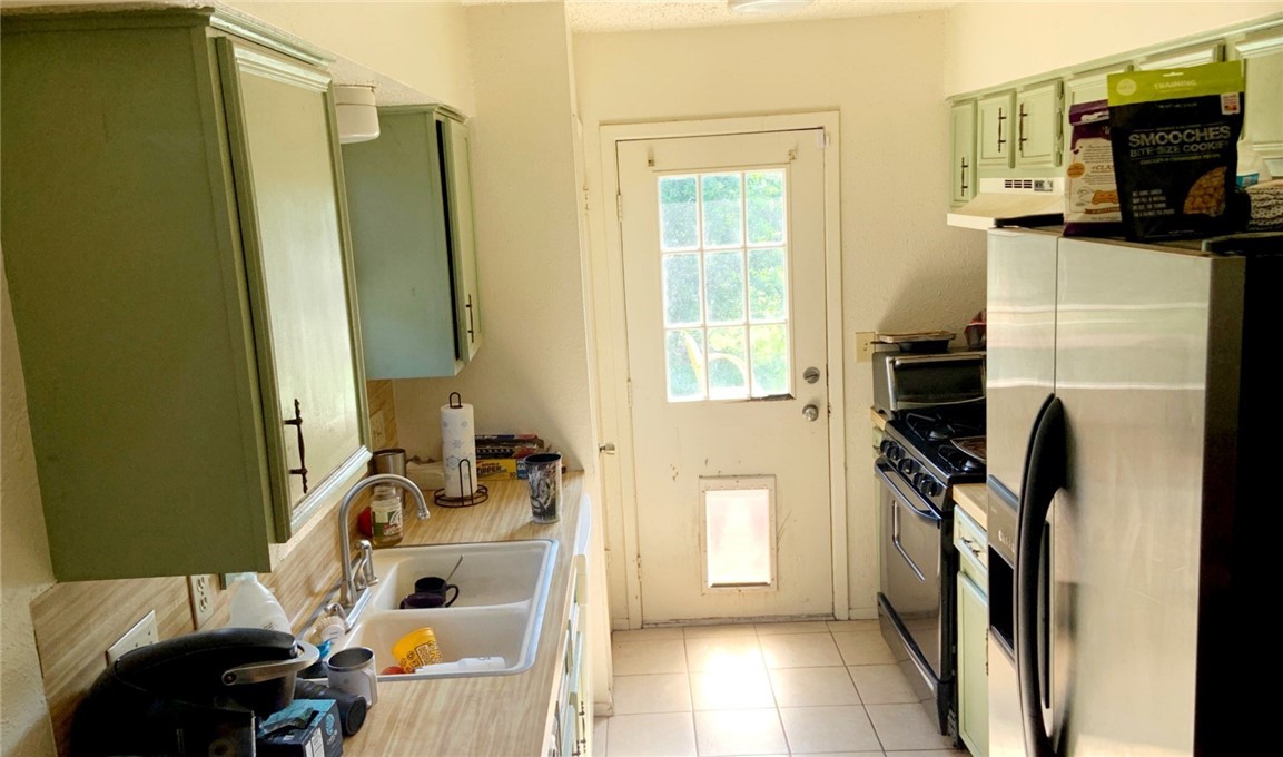 a bathroom with a sink a window and a mirror