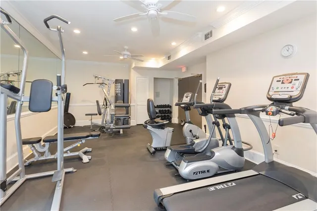 a room with gym equipment and air hockey table