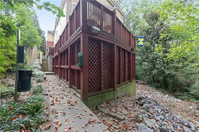 a view of a house with wooden fence