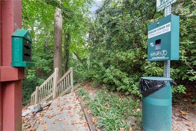 a street sign that is on a wooden fence