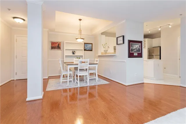 a view of a kitchen with dining table and chairs