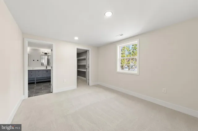 an empty room with closet area