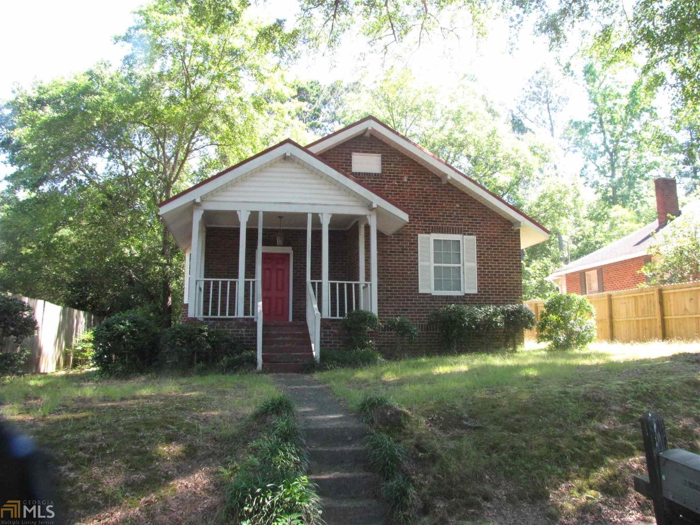 6 Locust Street Northeast Rome, GA 30161 - Photo 1 of 1 a view of a yard in front of a house with plants and large tree