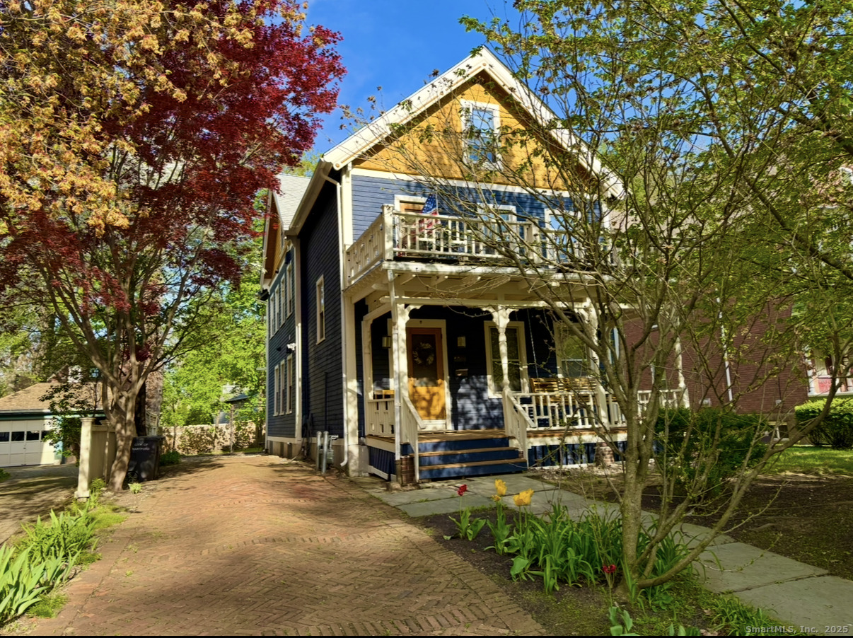front view of a building with a garden