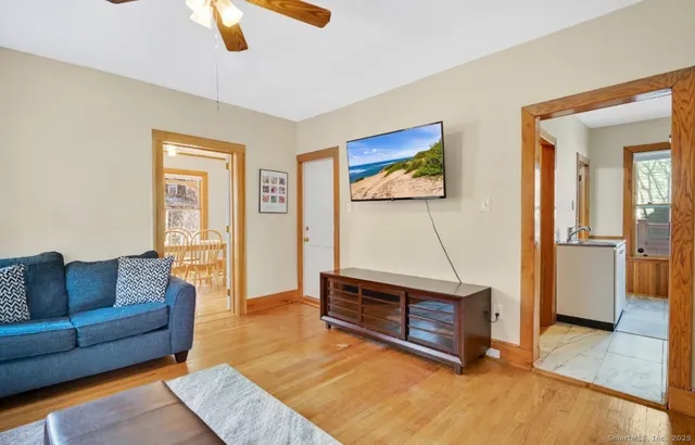 a living room with furniture and a flat screen tv