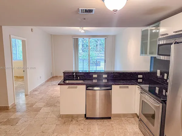 a kitchen with a stove and a sink