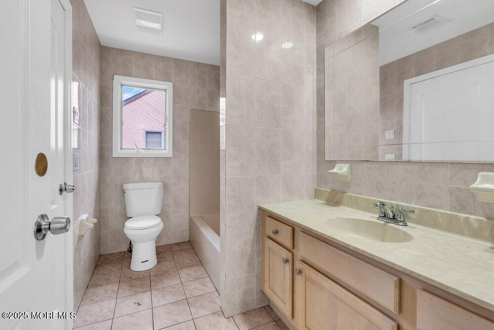 52 16th Street Toms River, NJ 08753 - Photo 27 of 44 a bathroom with a sink toilet and shower