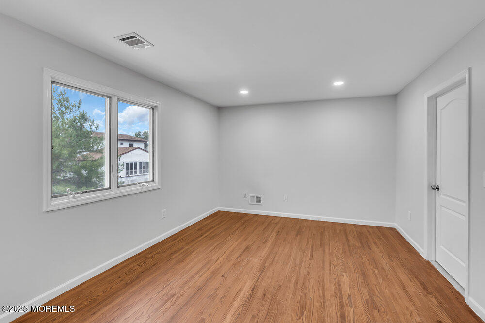 52 16th Street Toms River, NJ 08753 - Photo 29 of 44 a view of room with window and wooden floor