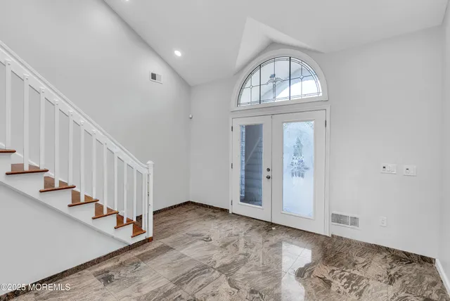 a view of entryway with wooden floor