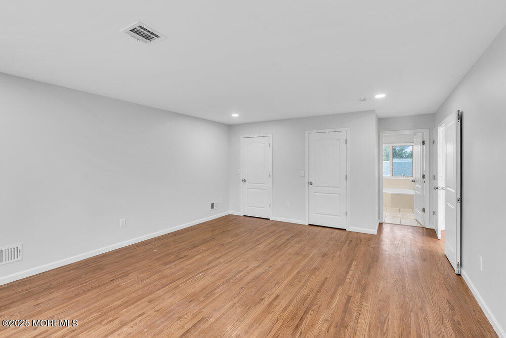 52 16th Street Toms River, NJ 08753 - Photo 40 of 44 a view of a big room with wooden floor and windows
