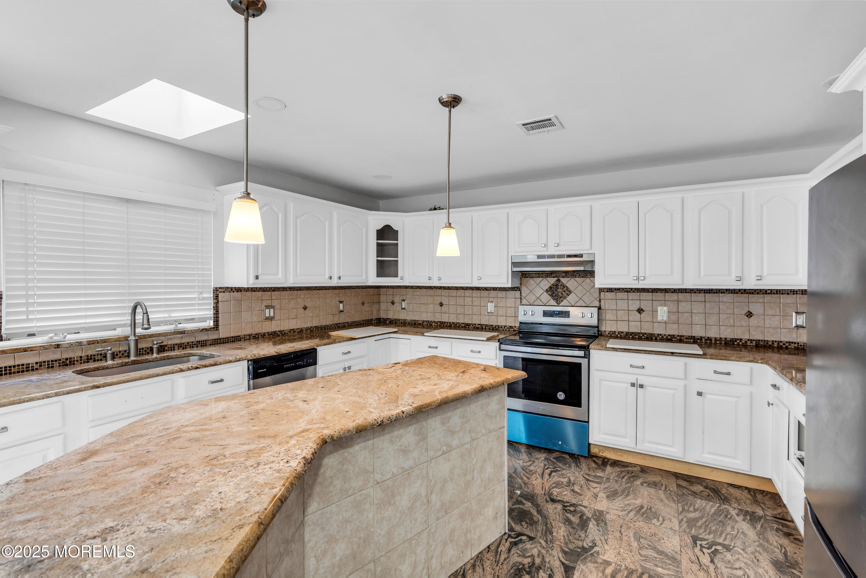 52 16th Street Toms River, NJ 08753 - Photo 7 of 44 a kitchen with stainless steel appliances granite countertop a sink a stove a center island a stove and cabinets