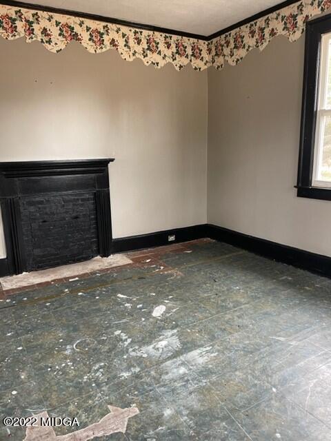 1427 Highway 80 Culloden, GA 31016 - Photo 2 of 8 a view of a room with a fireplace and a window