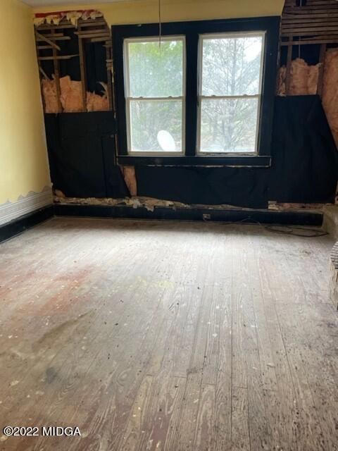 1427 Highway 80 Culloden, GA 31016 - Photo 5 of 8 an empty room with wooden floor and windows