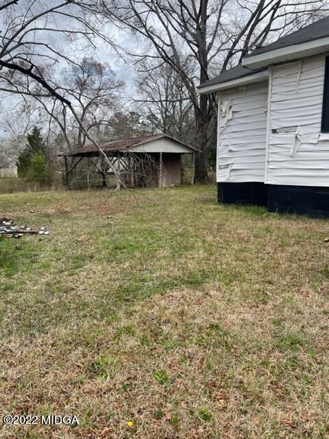 1427 Highway 80 Culloden, GA 31016 - Photo 7 of 8 a front view of a house with a yard