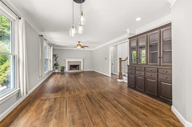 a view of a livingroom with furniture window and wooden floor