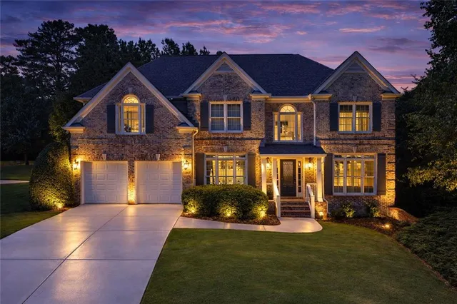 a front view of a house with a yard