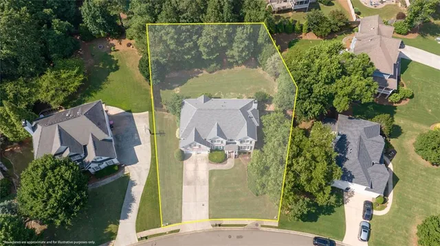 an aerial view of residential house with outdoor space and swimming pool