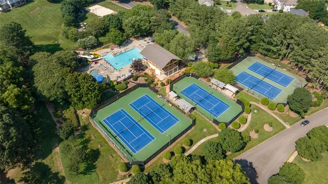 a view of a backyard with plants and patio