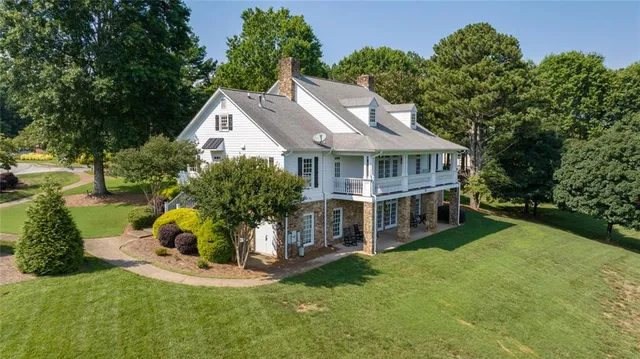 a view of a swimming pool with a yard