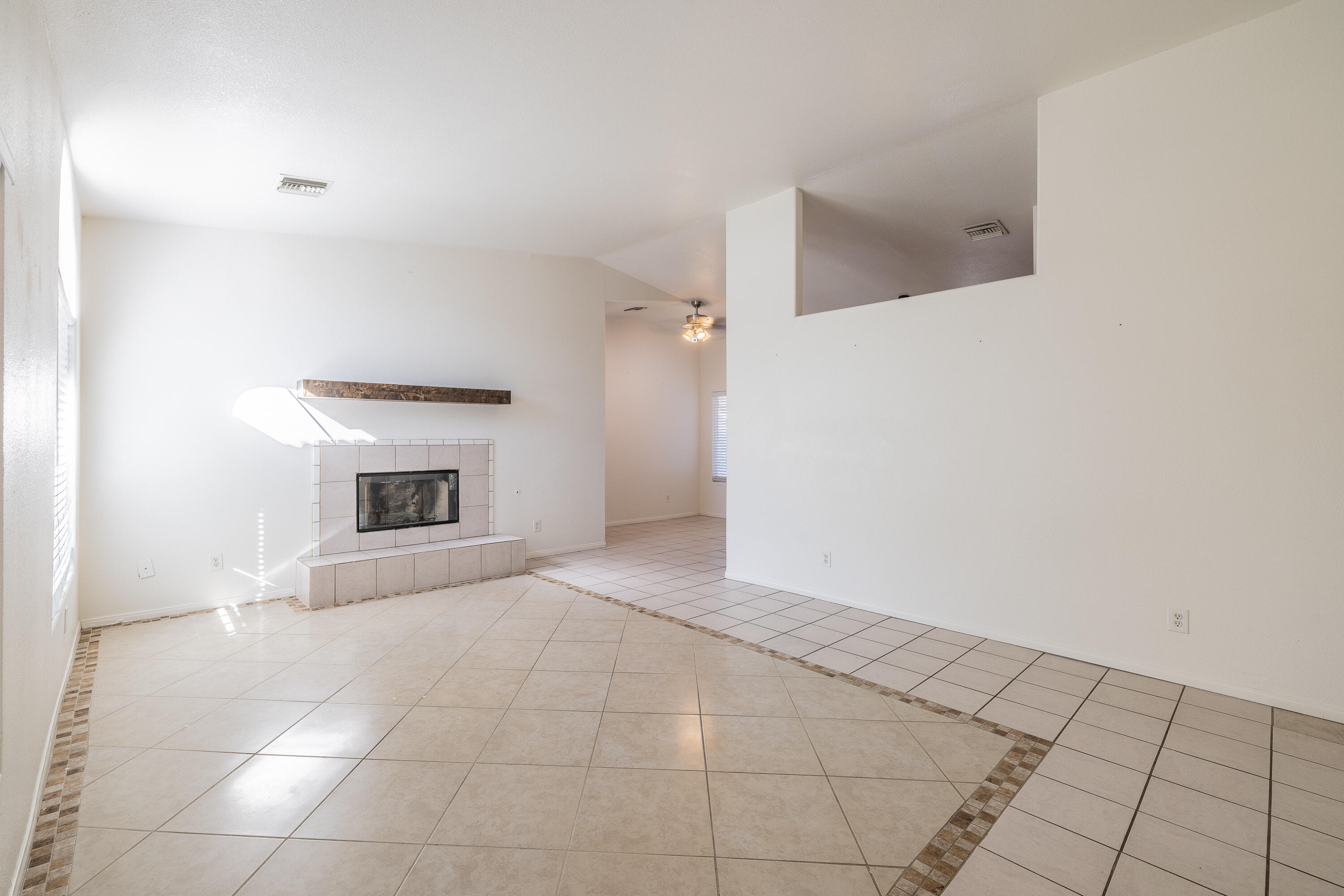 68090 Santelmo Road Cathedral City, CA 92234 - Photo 4 of 29 a view of empty room with a fireplace