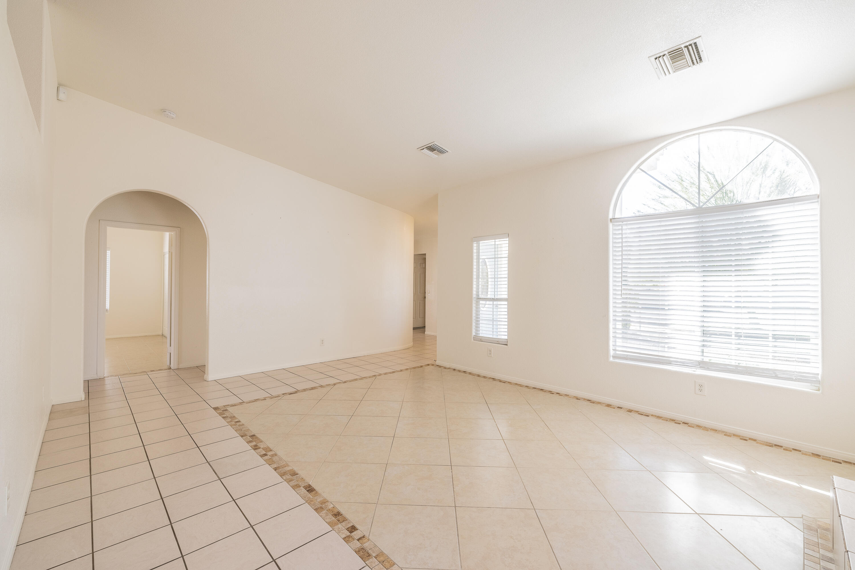 68090 Santelmo Road Cathedral City, CA 92234 - Photo 6 of 29 an empty room with windows