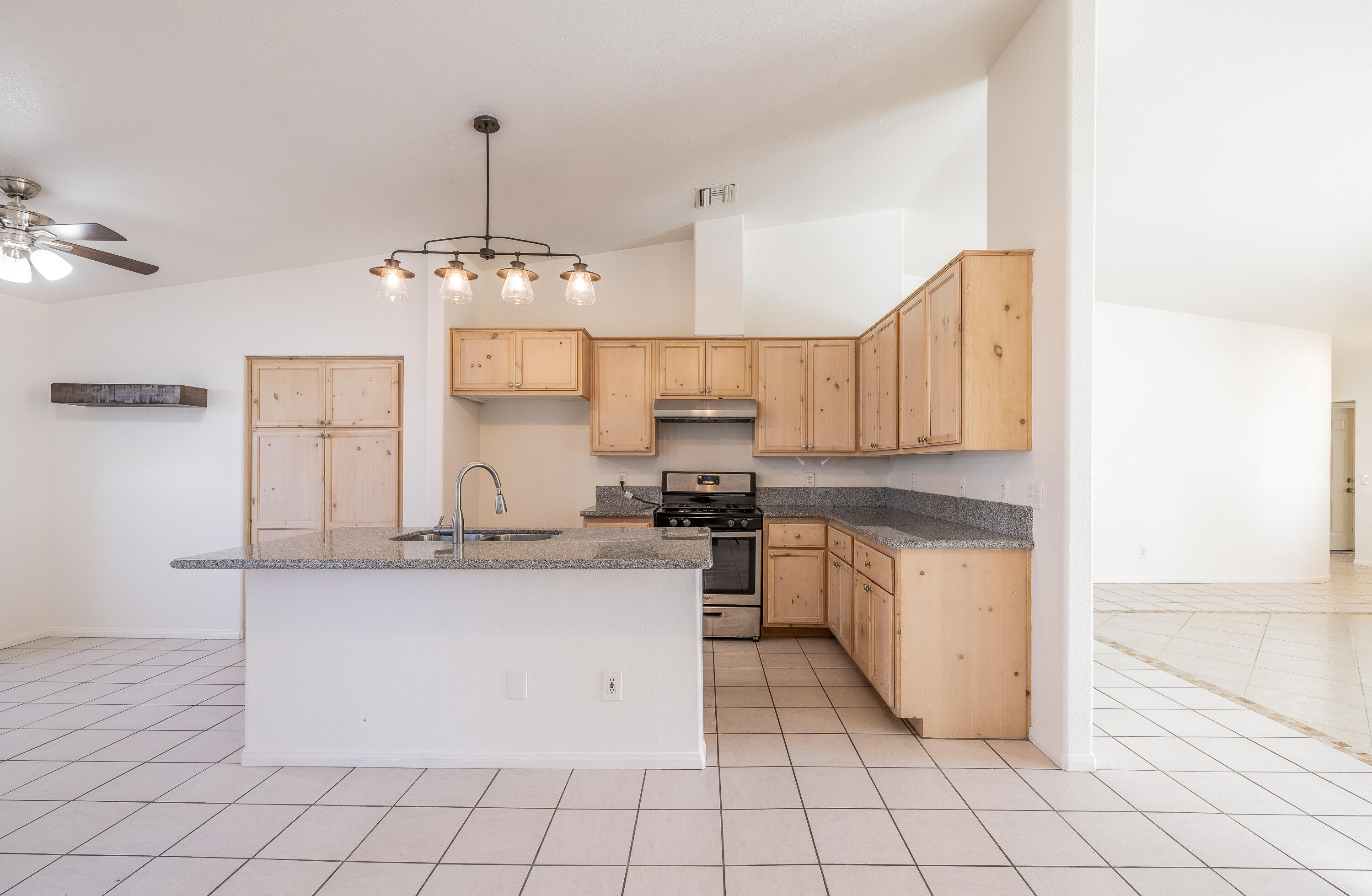 68090 Santelmo Road Cathedral City, CA 92234 - Photo 8 of 29 a kitchen with stainless steel appliances a sink and a refrigerator