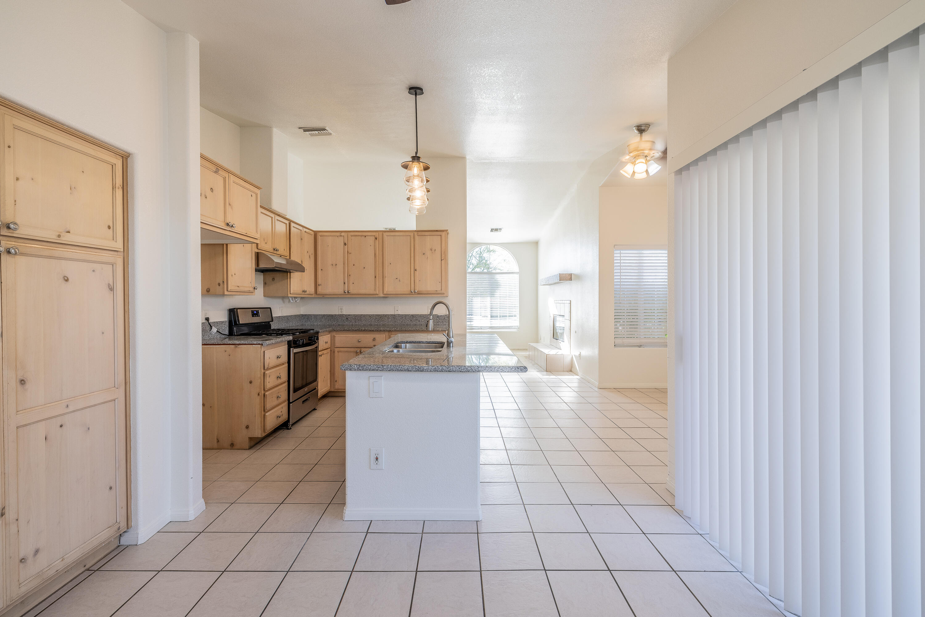 68090 Santelmo Road Cathedral City, CA 92234 - Photo 9 of 29 a kitchen with stainless steel appliances a refrigerator sink and cabinets