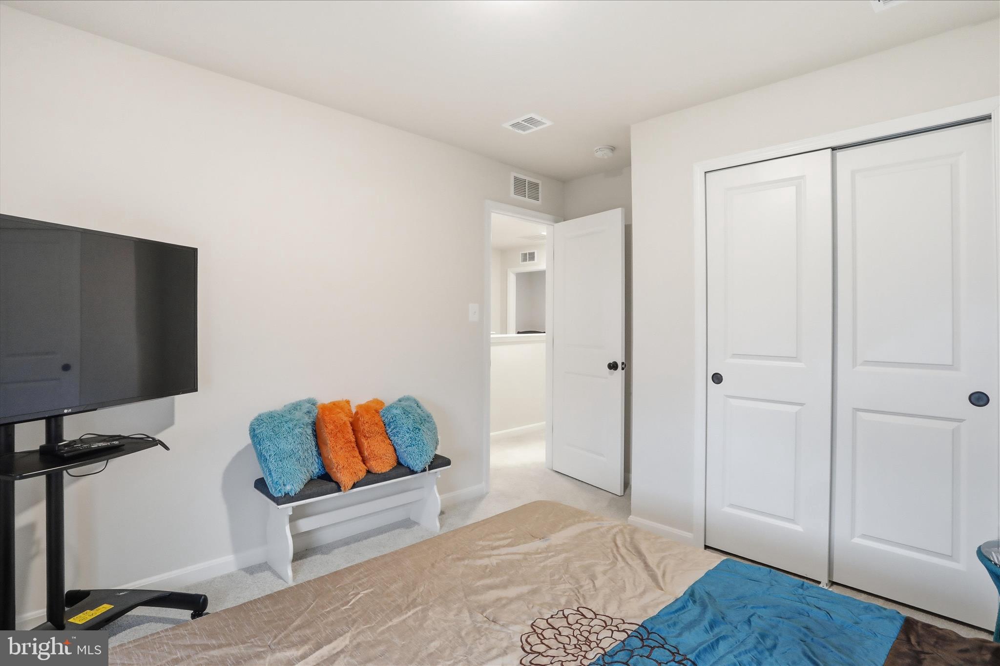 76 Diving Scaup Road Hedgesville, WV 25427 - Photo 22 of 48 a bedroom with a bed and a couch