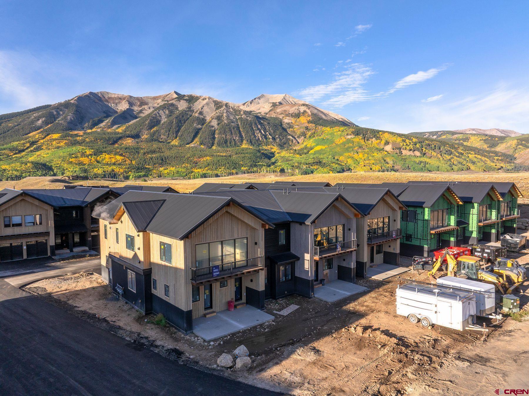 180 Elk Valley Road, Unit 104 Crested Butte, CO 81224 - Photo 22 of 27 a view of house with outdoor space and sitting area