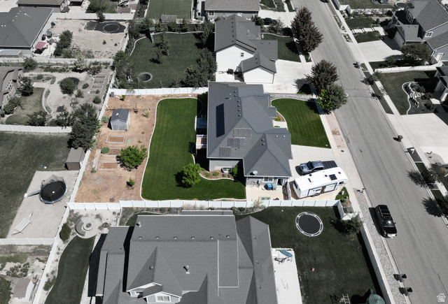 1145 North Christley Lane, Unit 48 Elk Ridge, UT 84651 - Photo 37 of 38 Expansive rear yard featuring a manicured lawn, established landscaping, and a dedicated garden area