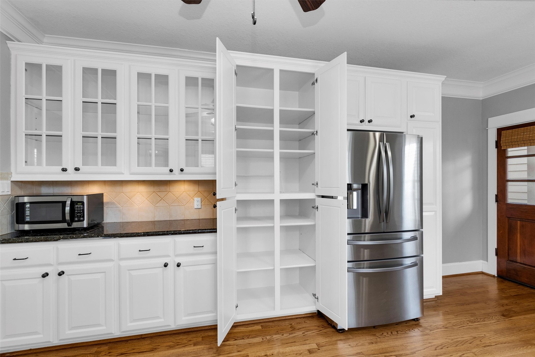 304 Vincent Street Houston, TX 77009 - Photo 13 of 36 a kitchen with stainless steel appliances granite countertop a refrigerator and a stove top oven
