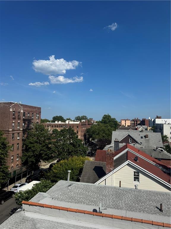 1926 83rd Street Brooklyn, NY 11214 - Photo 13 of 13 a view of a house with a yard and balcony