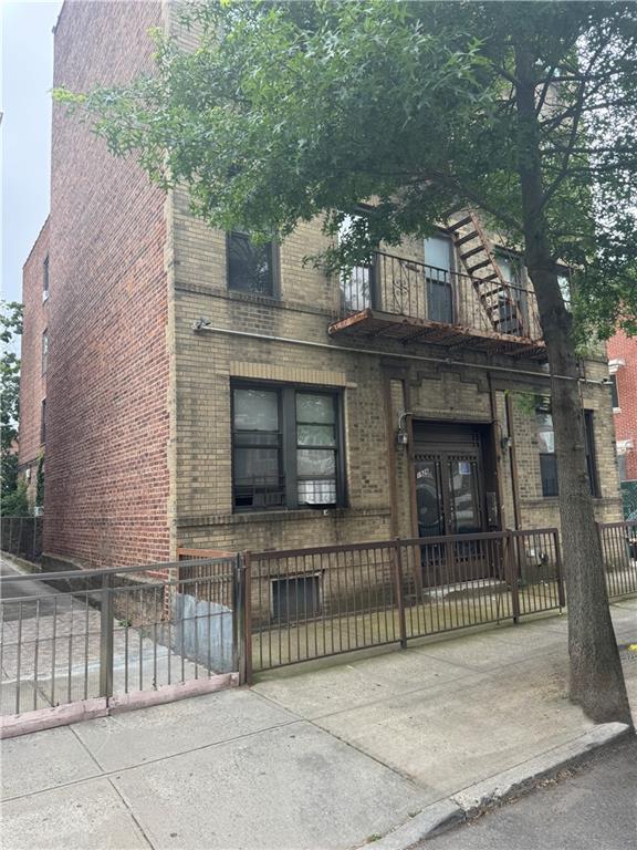 1926 83rd Street Brooklyn, NY 11214 - Photo 2 of 13 a view of a house with a iron gate