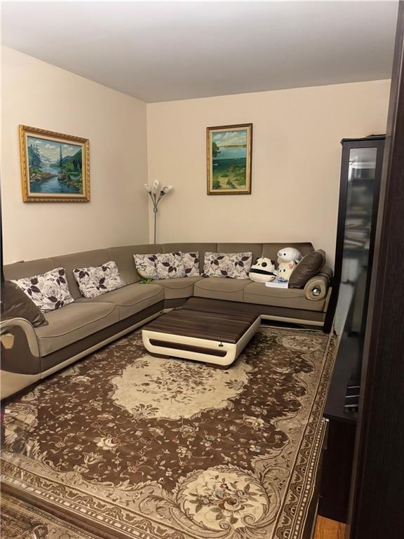 1926 83rd Street Brooklyn, NY 11214 - Photo 6 of 13 a living room with couch