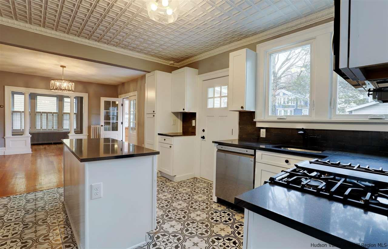 53 Spring Street Kingston, NY 12401 - Photo 11 of 26 a kitchen with a appliances a sink and cabinets