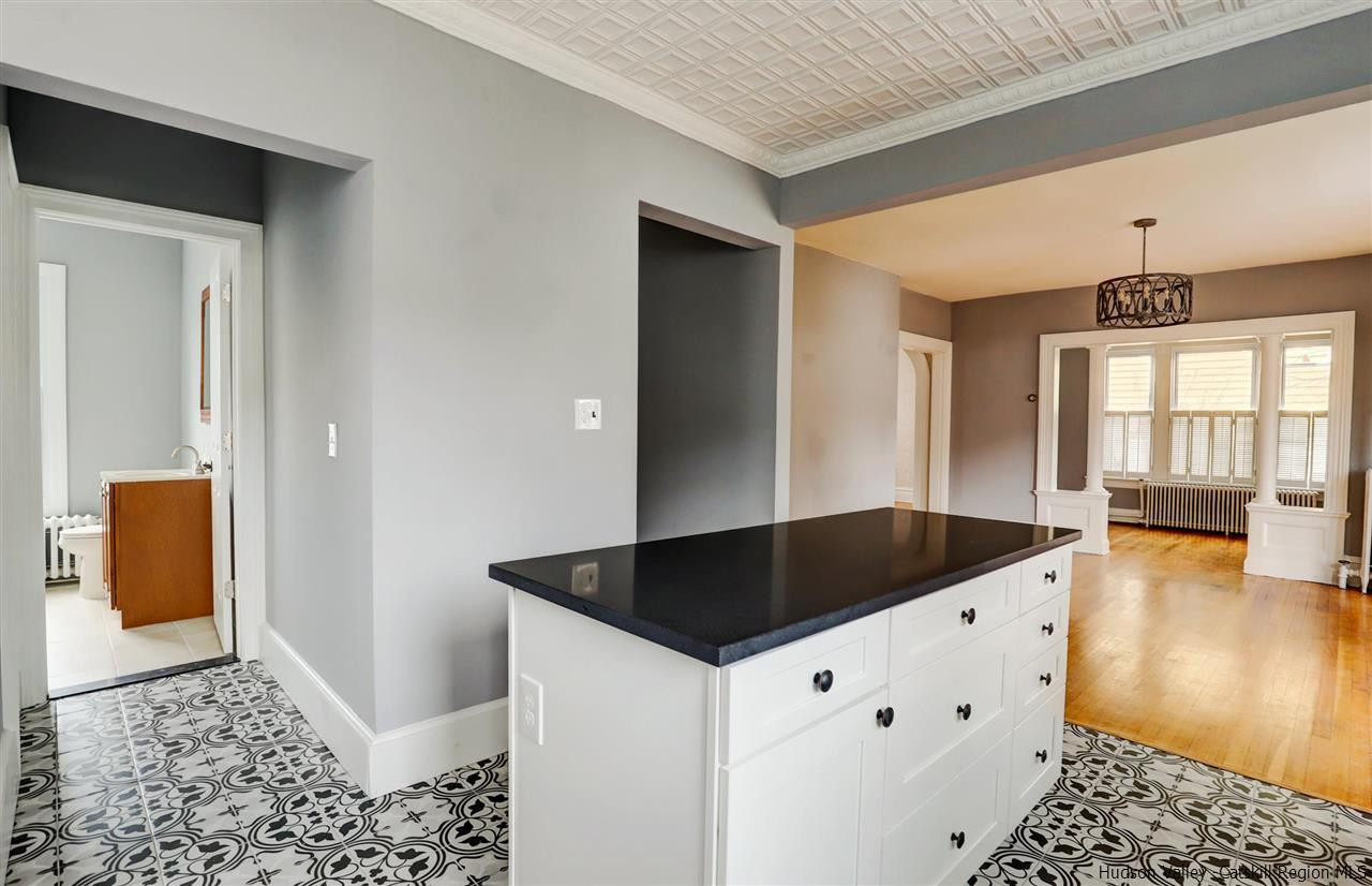 53 Spring Street Kingston, NY 12401 - Photo 12 of 26 a kitchen with granite countertop a sink and a stove top oven