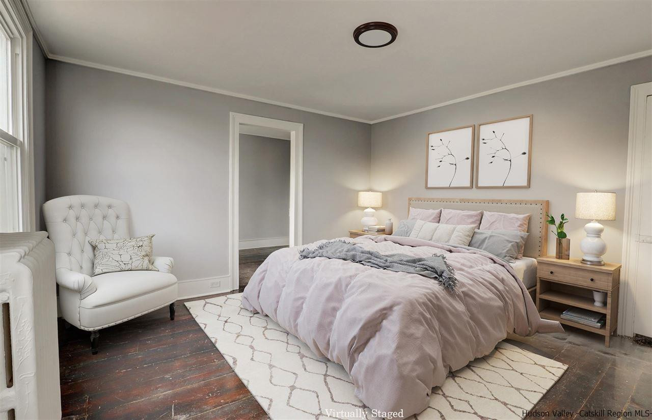 53 Spring Street Kingston, NY 12401 - Photo 16 of 26 a bedroom with a bed and a couch