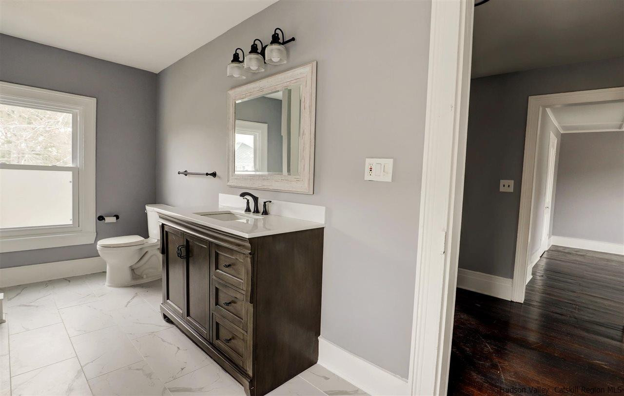 53 Spring Street Kingston, NY 12401 - Photo 18 of 26 a bathroom with a sink and a mirror