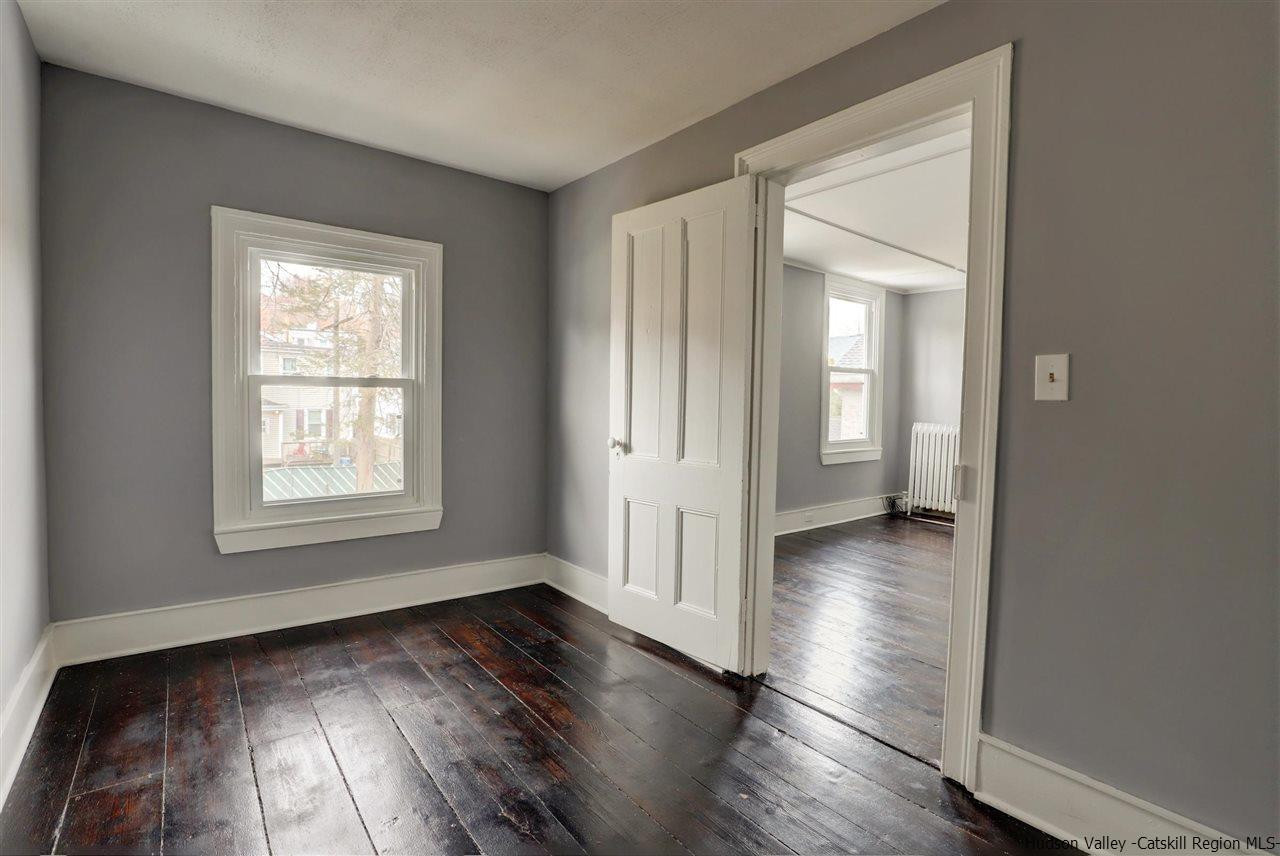 53 Spring Street Kingston, NY 12401 - Photo 21 of 26 a view of a room with wooden floor and window