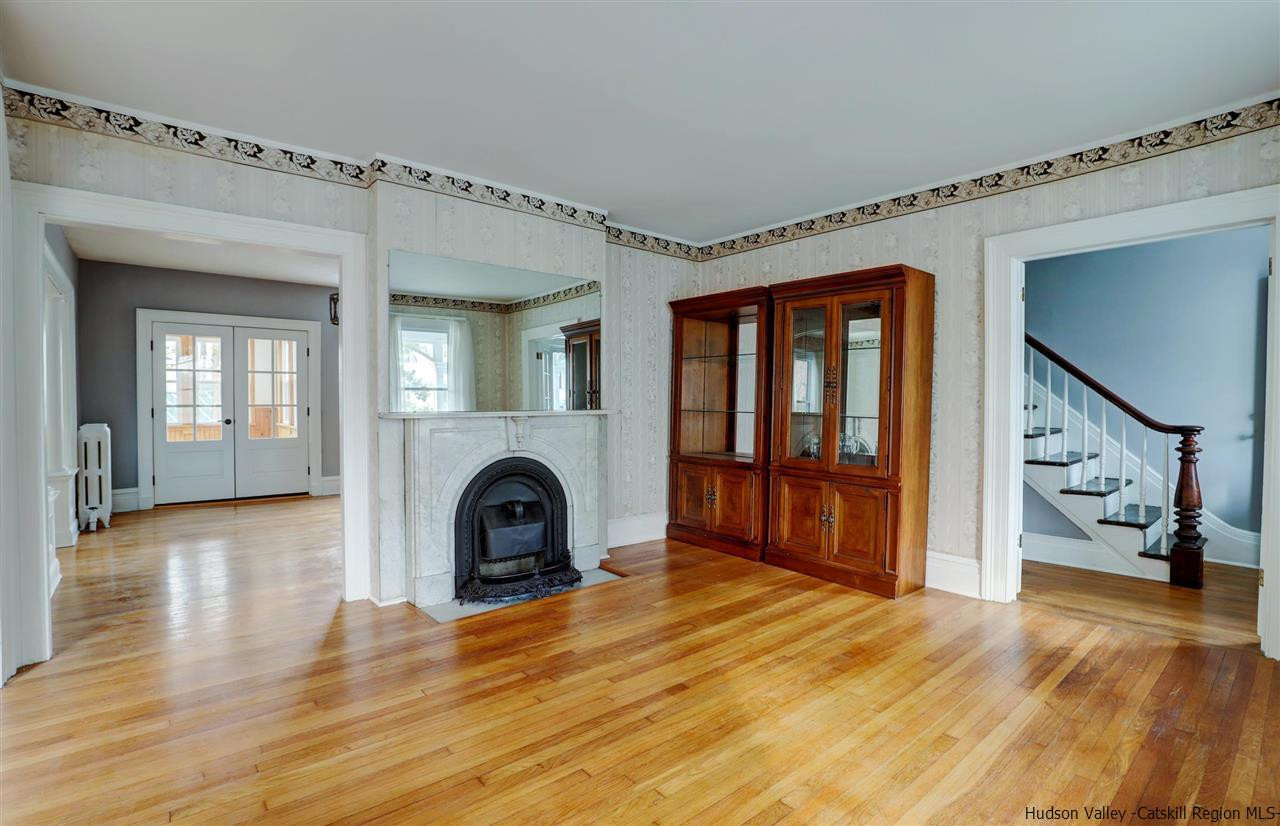 53 Spring Street Kingston, NY 12401 - Photo 4 of 26 a view of a livingroom with furniture and a fireplace