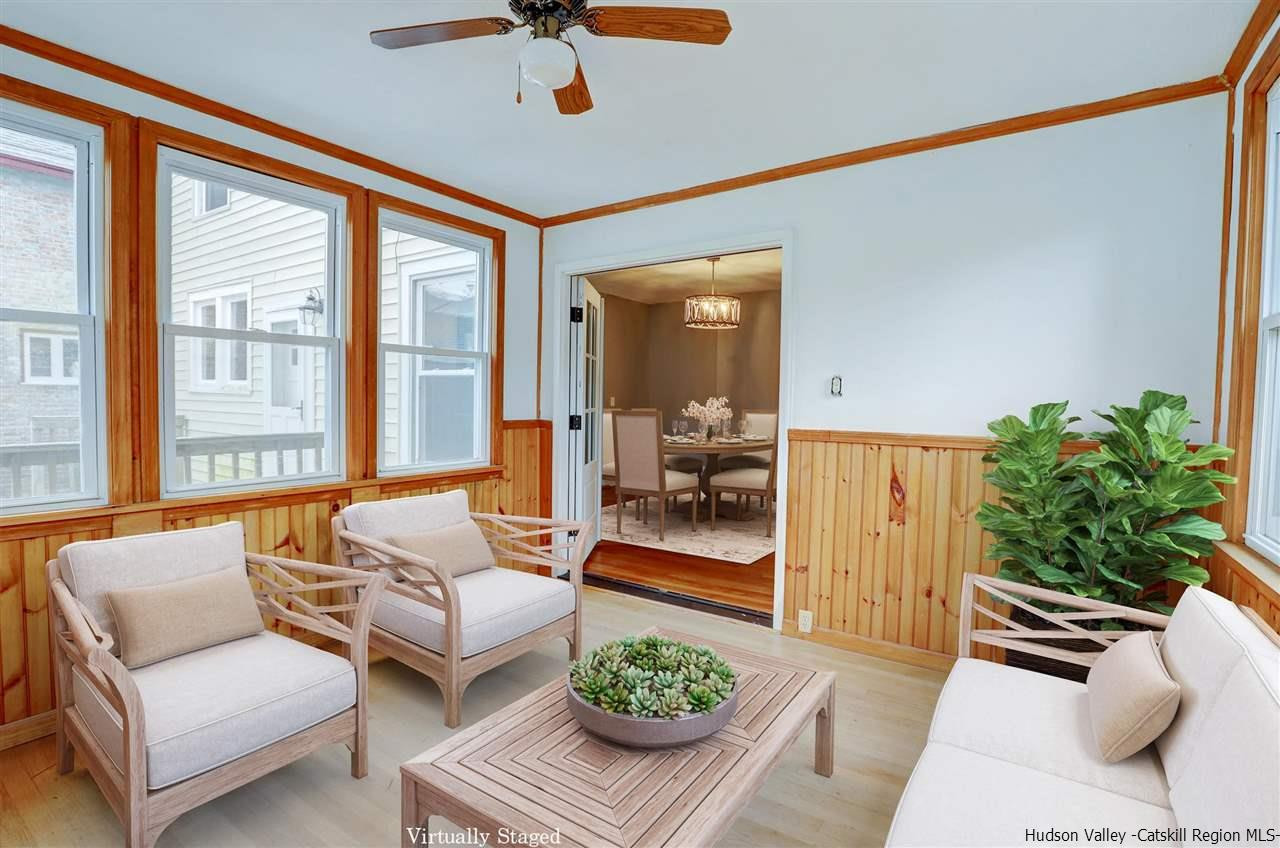 53 Spring Street Kingston, NY 12401 - Photo 7 of 26 a living room with furniture and a large window