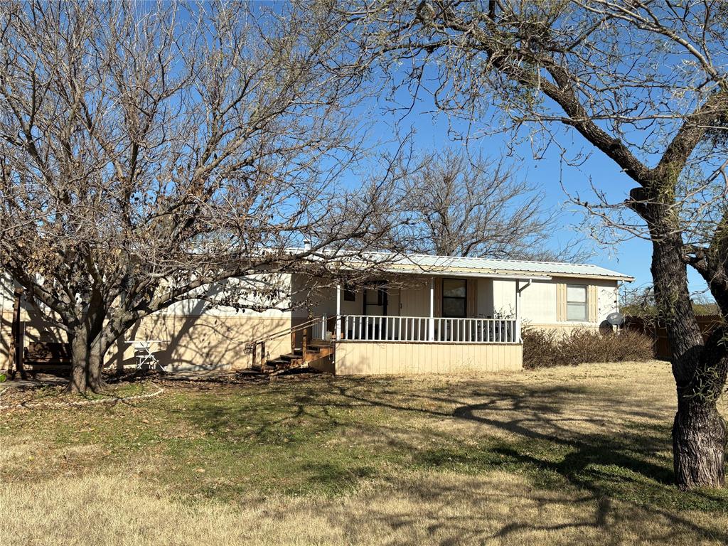 514 Fish Haven Road Graford, TX 76449 - Photo 2 of 21 a front view of a house with a yard and garage
