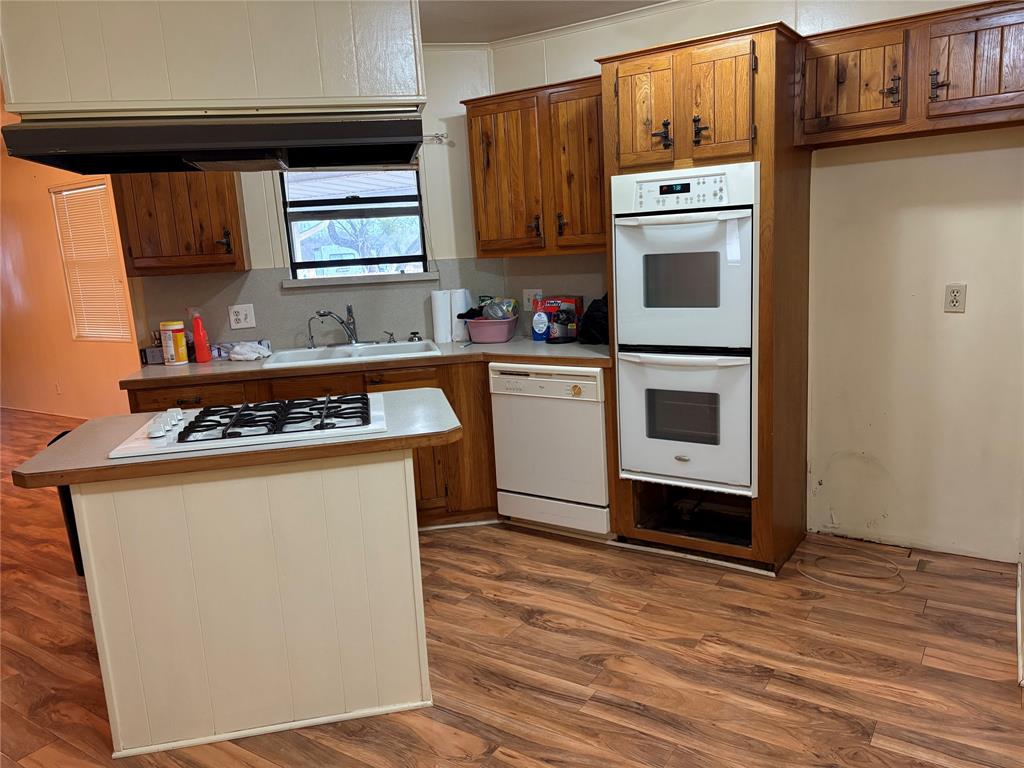514 Fish Haven Road Graford, TX 76449 - Photo 7 of 21 a kitchen with stainless steel appliances a stove a microwave and a refrigerator