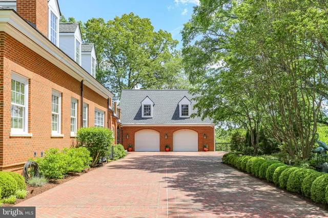 a view of a livingroom with wooden floor and a fireplace