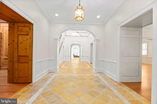 a view of an empty room with a fireplace