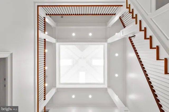 a bathroom with a granite countertop toilet a sink and mirror