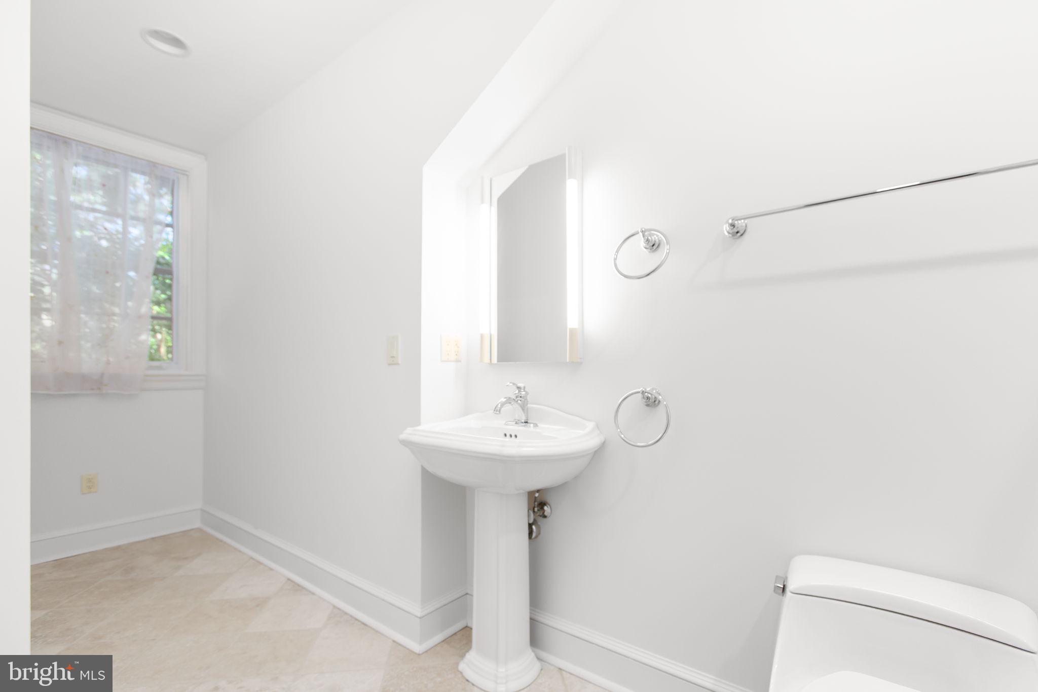 1711 Highland Road Fredericksburg, VA 22401 - Photo 86 of 145 a bathroom with a sink a mirror and a toilet