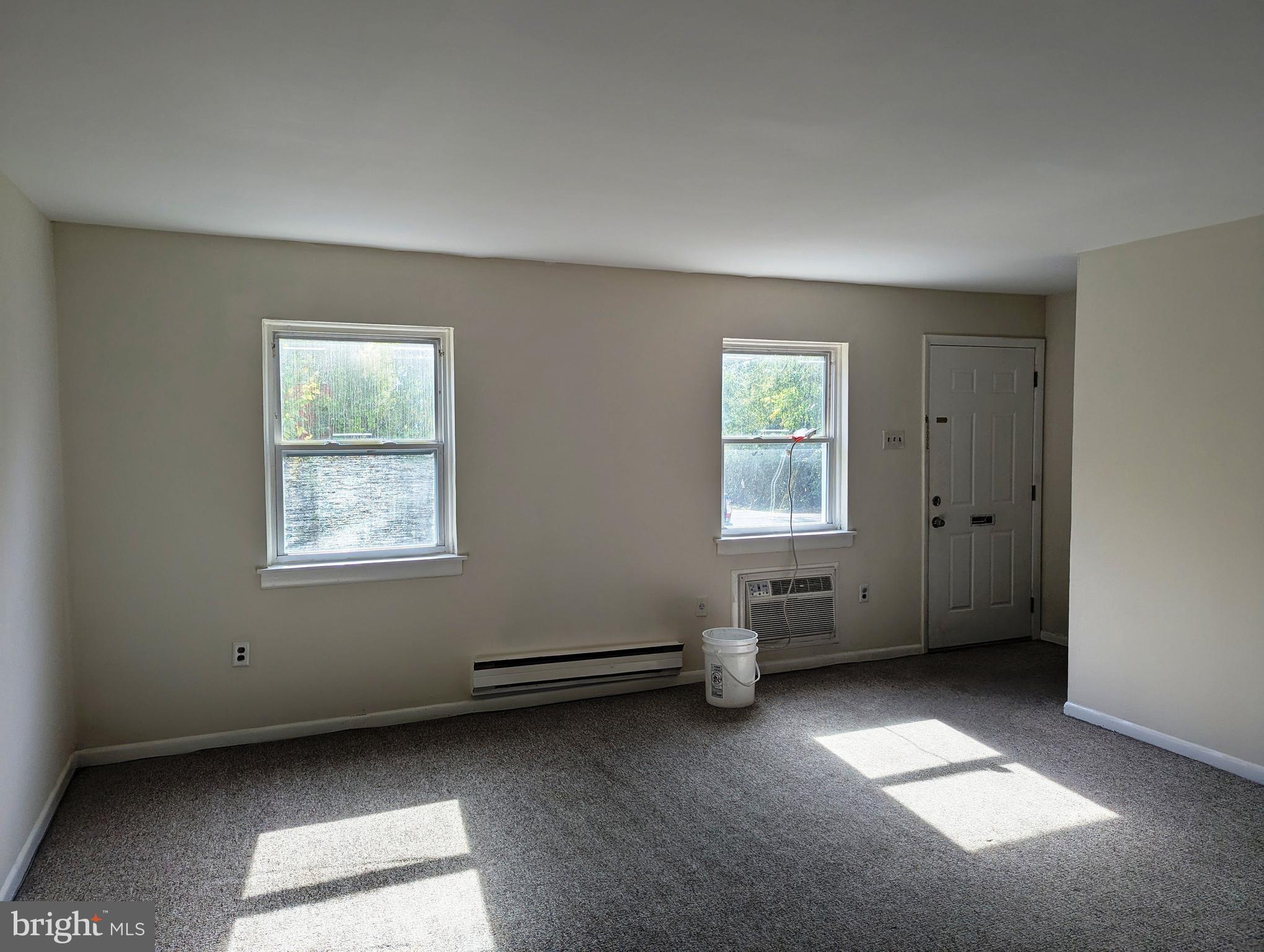 2886 Limekiln Pike, Unit C Glenside, PA 19038 - Photo 2 of 10 a view of an empty room with a window