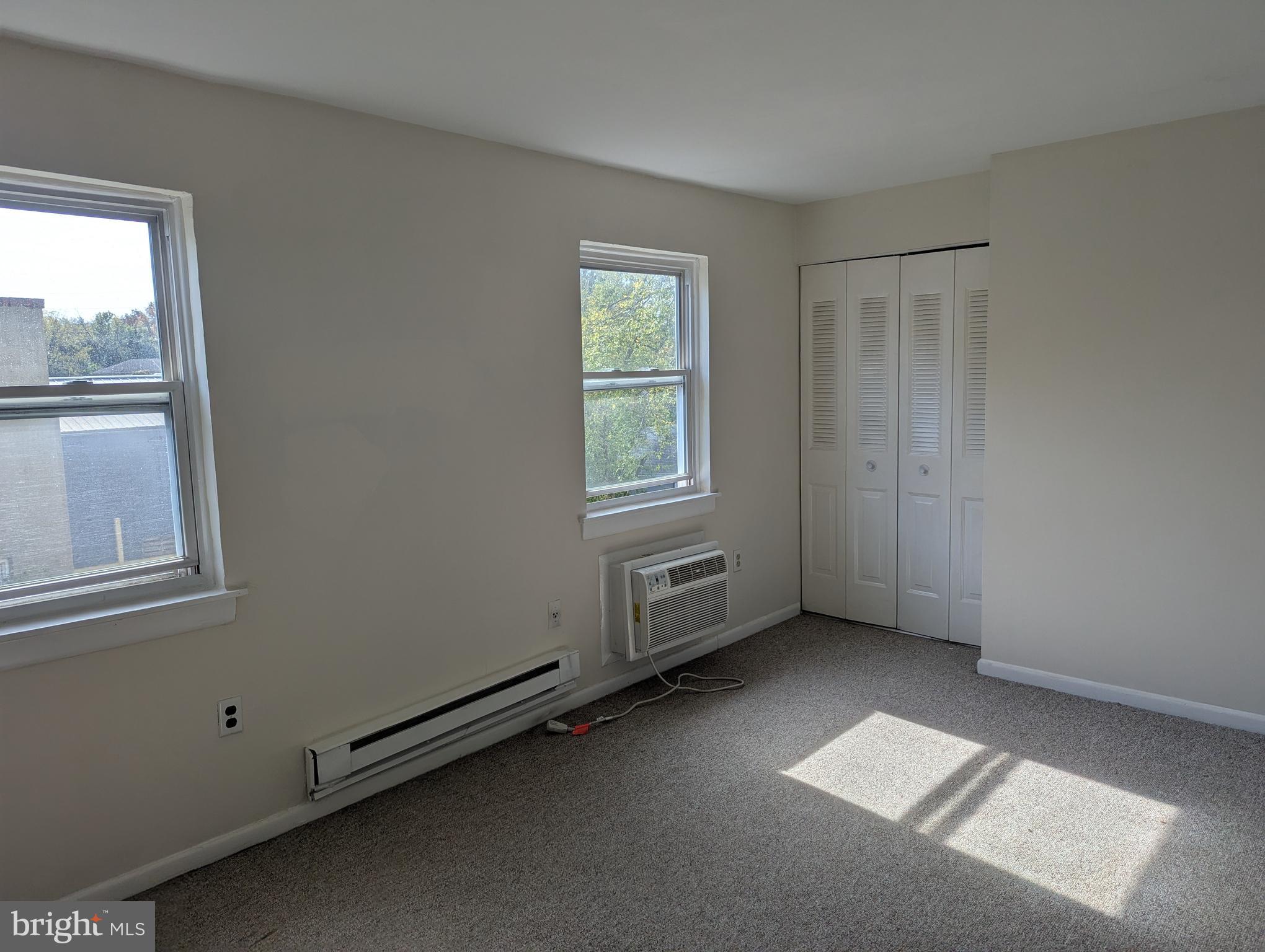 2886 Limekiln Pike, Unit C Glenside, PA 19038 - Photo 6 of 10 an empty room with windows