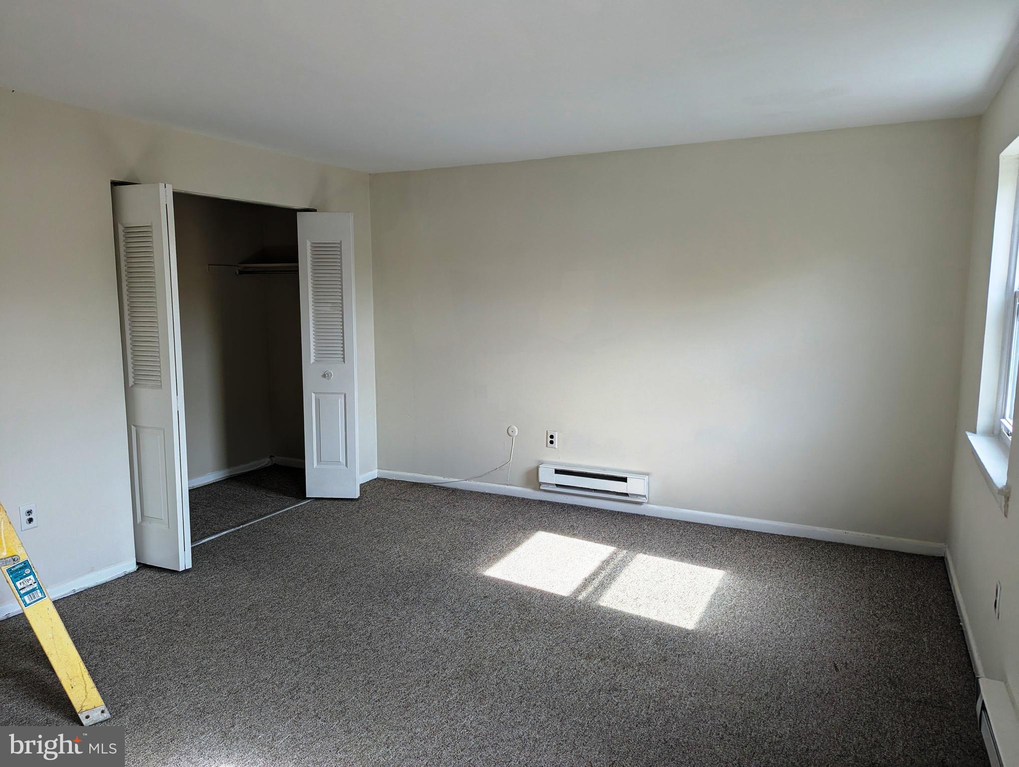 2886 Limekiln Pike, Unit C Glenside, PA 19038 - Photo 7 of 10 an empty room with a window